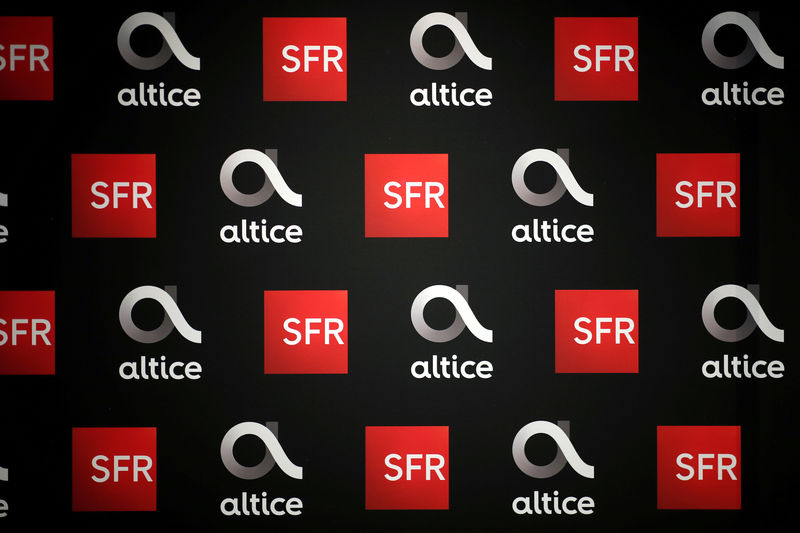 © Reuters. FILE PHOTO: Altice and SFR logos are pictured before a news conference in Paris