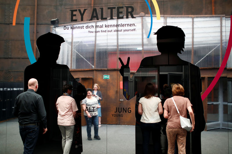 © Reuters. People visit an exhibition about demografic change called 'Ey Alter' by carmaker Mercedes Benz in Berlin