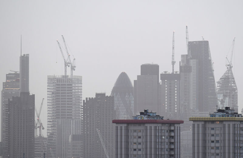 © Reuters. FILE PHOTO: Construction work is seen on high-rise office blocks in the City of London in London, Britain