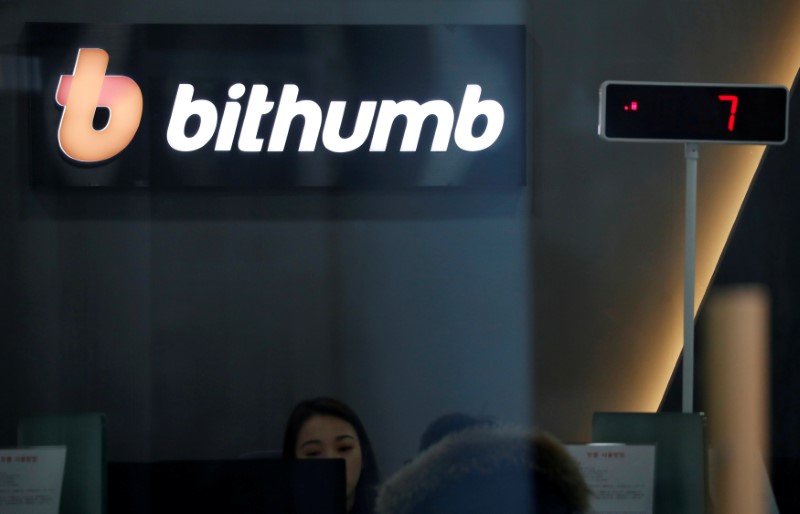 © Reuters. FILE PHOTO: The logo of Bithumb is seen at its cryptocurrencies exchange in Seoul