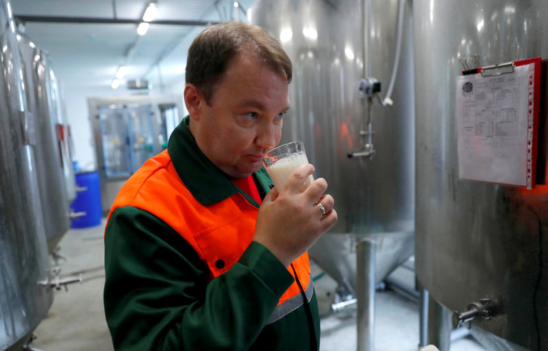 © Reuters. Chief brewer Alexei Saburov samples beer at the Melody Brew brewery in Polevskoy