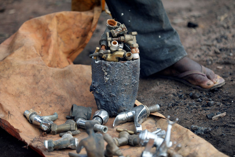© Reuters. Tap heads are seen prepared as bronze materials at a melting site on Igun street in Benin City