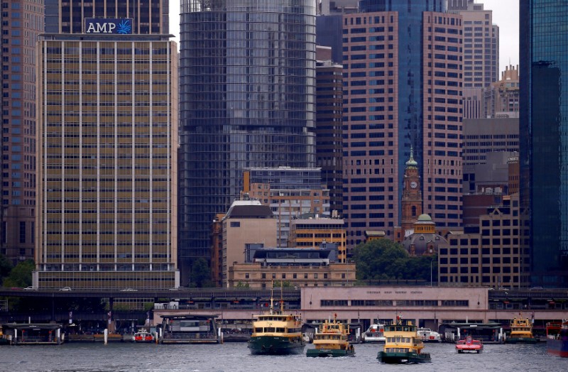 © Reuters. FILE PHOTO: The head office building of AMP Ltd, Australia's biggest retail wealth manager, is seen behind ferries docking at Sydney's Circular Quay in Australia