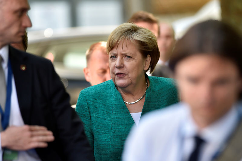 © Reuters. German Chancellor Merkel arrives at a EPP meeting ahead of a EU summit in Brussels