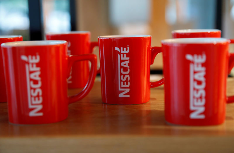 © Reuters. FILE PHOTO: Nescafe mugs are pictured at Nestle Research Center in Orbe