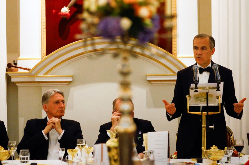 © Reuters. Britain's Chancellor of the Exchequer Philip Hammond listens to the Governor of the Bank of England Mark Carney's speech at the Annual Mansion House dinner in London