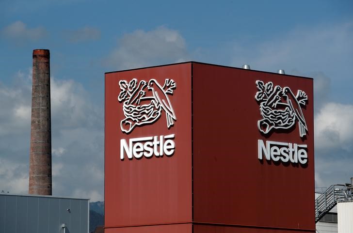© Reuters. A Nestle logo is pictured on a coffee factory in Orbe