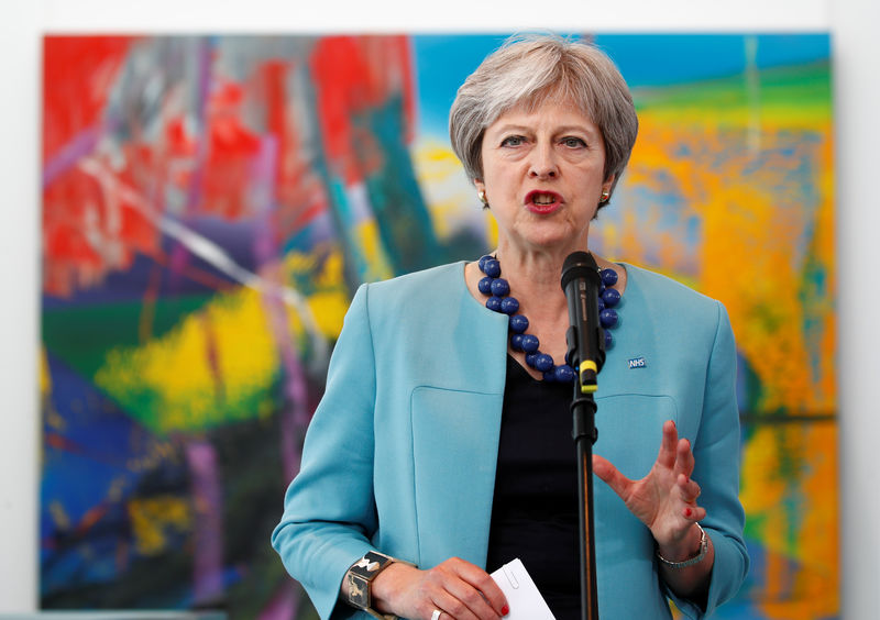 © Reuters. Britain's Prime Minister Theresa May speaks as she is welcomed by German Chancellor Angela Merkel in Berlin