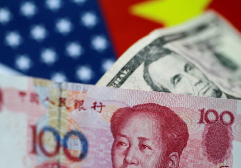 © Reuters. FILE PHOTO: Illustration photo of U.S. Dollar and China Yuan notes
