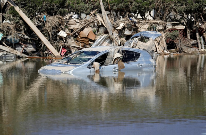 © Reuters. A submerged Toyota Motor's car is seen in a flooded area in Mabi town in Kurashiki