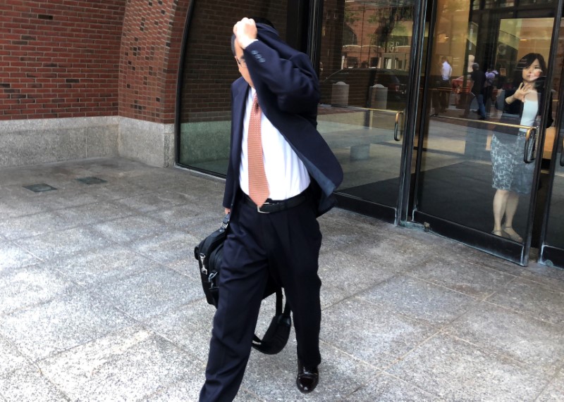 © Reuters. Former Merrimack Pharmaceuticals Inc. employee Songjiang Wang exits the federal courthouse in Boston