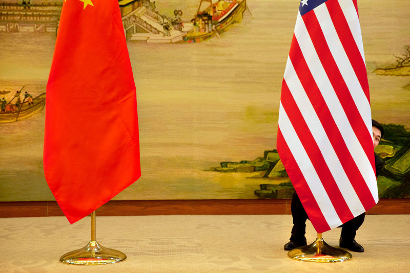 © Reuters. FILE PHOTO: U.S. flag is tweaked ahead of a news conference between U.S. Secretary of State John Kerry and Chinese Foreign Minister Wang Yi at the Ministry of Foreign Affairs in Beijing