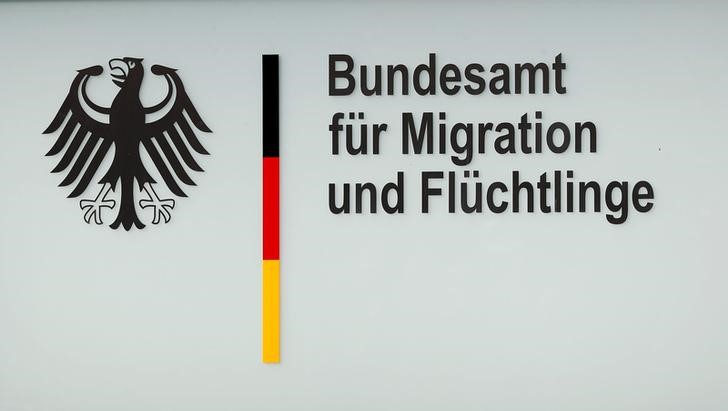 © Reuters. A sign is pictured on an office building of the Federal Office for Migration and Refugees in Berlin
