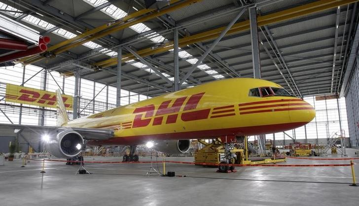 © Reuters. A cargo aircraft stands inside the newly opened Deutsche Post's DHL Express division aviation hub at the Leipzig/Halle airport