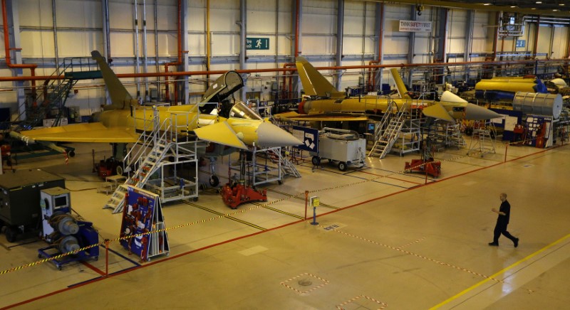 © Reuters. A worker crosses the floor of the Eurofighter Typhoon production line at BAE systems Warton plant near Preston