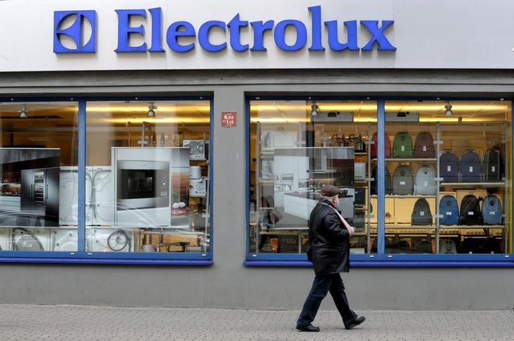 © Reuters. FILE PHOTO: A man walks past an Electrolux shop in Riga