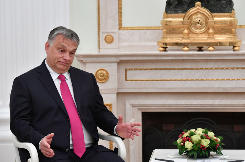 © Reuters. Hungarian PM Orban speaks with Russian President Putin during their meeting at the Kremlin in Moscow