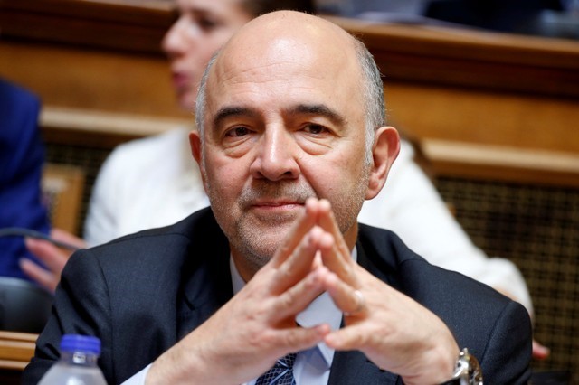 © Reuters. FILE PHOTO: European Economic and Financial Affairs Commissioner Pierre Moscovici attends a parliamentary committee meeting in Athens
