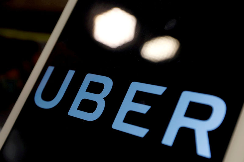 © Reuters. FILE PHOTO: The logo of Uber is seen on an iPad, during a news conference to announce Uber resumes ride-hailing service, in Taipei
