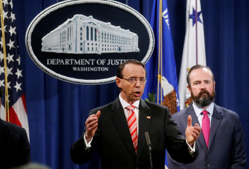 © Reuters. FILE PHOTO: Deputy U.S. Attorney General Rosenstein announces indictments in special counsel Mueller's Russia investigation at the Justice Department in Washington