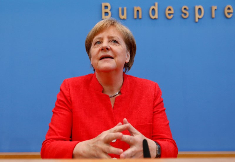 © Reuters. German Chancellor Angela Merkel holds the annual summer news conference in Berlin