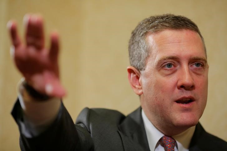© Reuters. FILE PHOTO: James Bullard, President of the St. Louis Federal Reserve Bank, speaks to Reuters in Boston