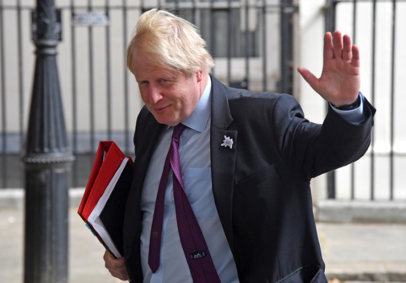 © Reuters. FILE PHOTO: Britain's Foreign Secretary Boris Johnson waves as he leaves Downing Street in London