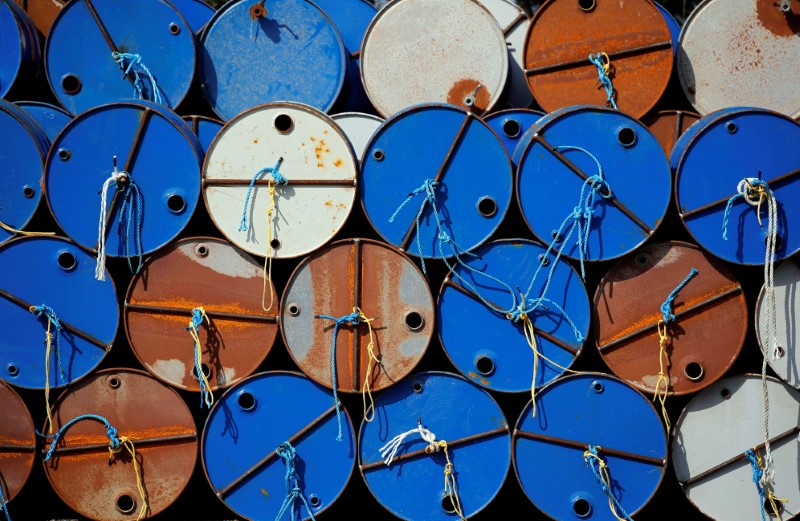 © Reuters. Oil barrels are pictured at the site of Canadian group Vermilion Energy in Parentis-en-Born