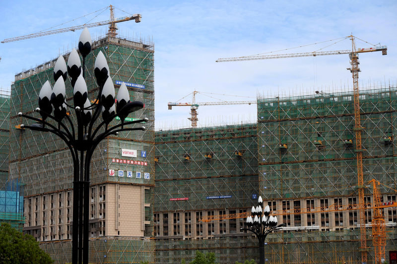 © Reuters. FILE PHOTO: Residential buildings under construction are seen in Quanzhou, Fujian