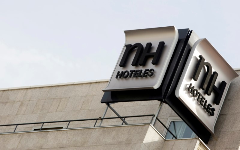 © Reuters. FILE PHOTO: The logo of Spanish NH Hoteles chain is seen on the roof of one of its hotel in central Madrid