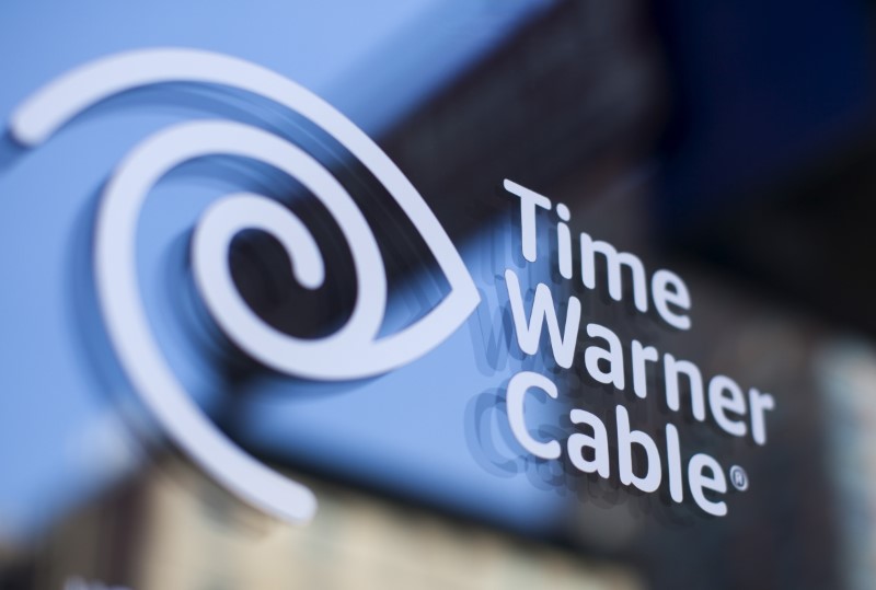 © Reuters. A Time Warner Cable sign and logo are seen on a Time Warner Cable store in the Manhattan borough of New York City