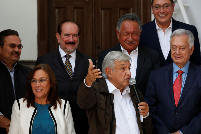 © Reuters. Mexico's president-elect Andres Manuel Lopez Obrador talks to the media next to his pick Energy Minister Rocio Nahle, Pemex's next chief executive Octavio Romero, at his campaign headquarters in Mexico City,