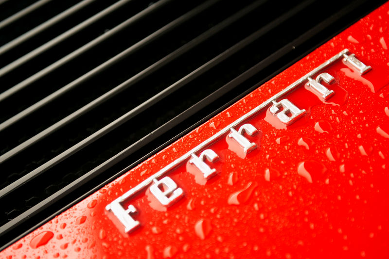 © Reuters. FILE PHOTO: The Ferrari Insignia is seen at the back of a Ferrari Testarossa during a media tour of the Fullerton Concours d'Elegance in Singapore