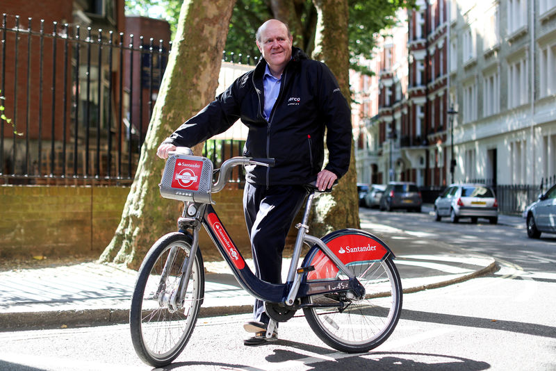 © Reuters. FILE PHOTO: Rupert Soames, CEO of Serco Group Plc poses for a photograph on a London rental bike outside their offices in London