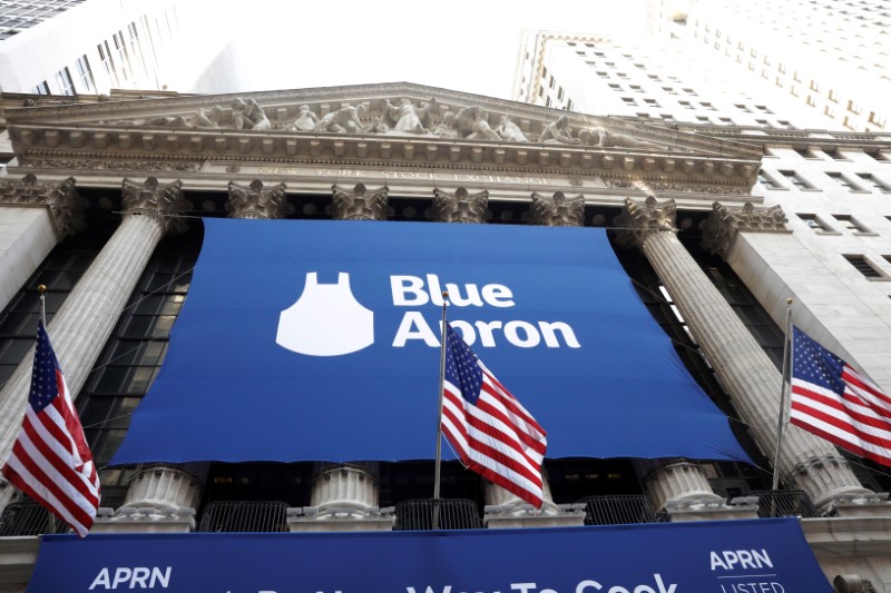 © Reuters. The logo of Blue Apron is shown on a large sign in front of the New York Stock Exchange before the company's IPO in New York