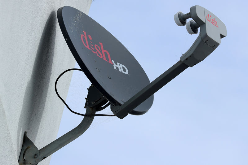 © Reuters. FILE PHOTO: A Dish Network satellite dish is shown on a residential home in Encinitas, California