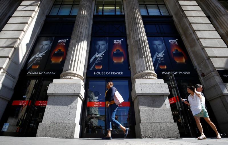 © Reuters. Shoppers walk past the King William Street branch of House of Fraser in central London