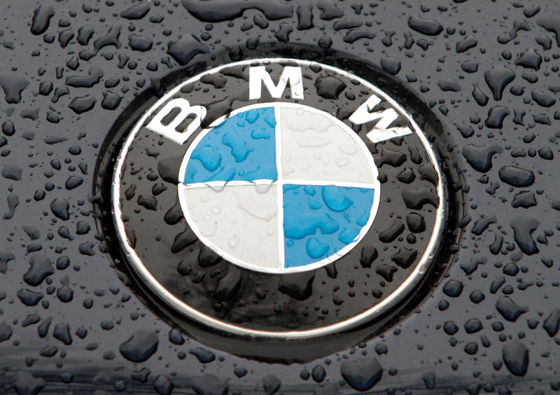 © Reuters. FILE PHOTO: The logo of German car manufacturer BMW is seen on the bonnet of a vehicle covered with water drops in Kiev