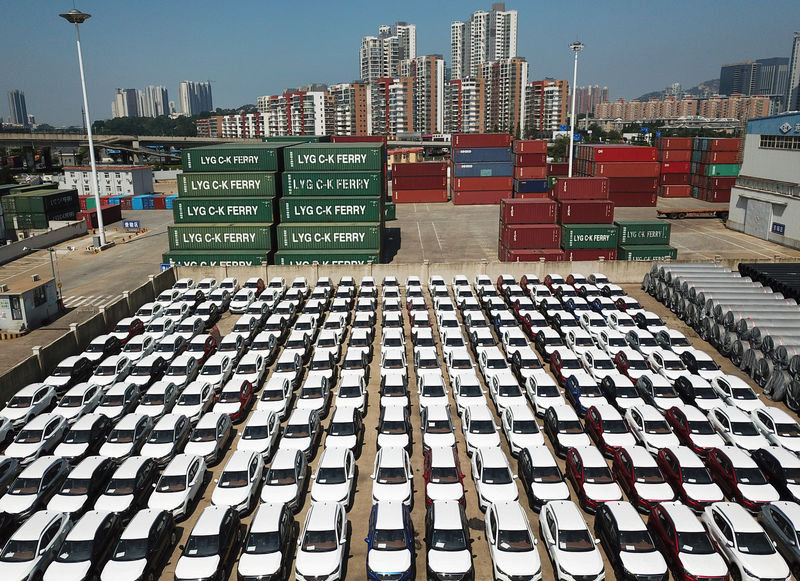 © Reuters. Cars to be exported sit at a port in Lianyungang