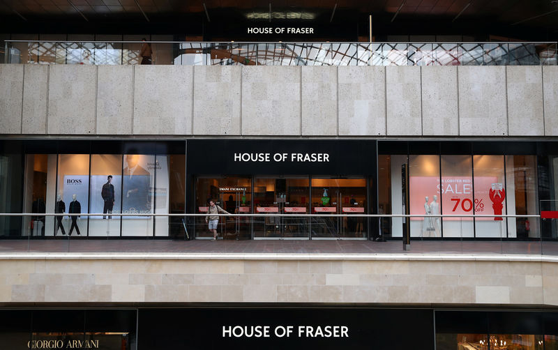 © Reuters. A man leaves a House of Fraser store in Bristol