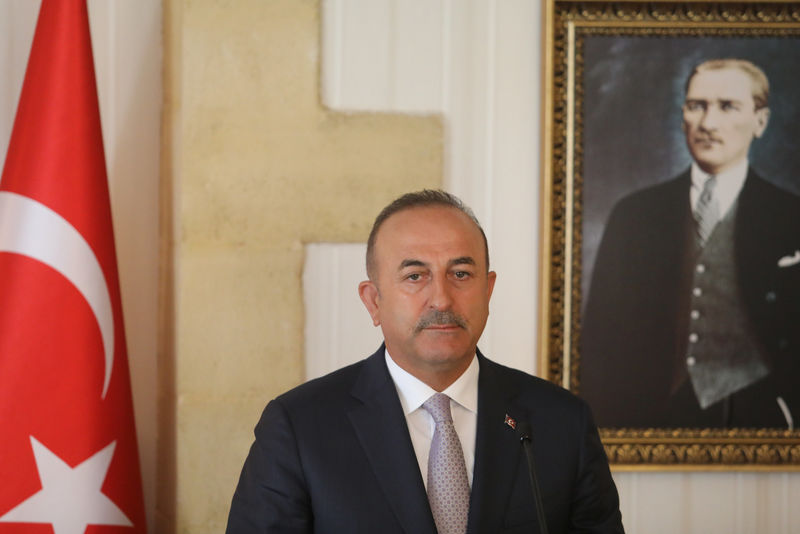 © Reuters. Turkey's Foreign Minister Mevlut Cavusoglu attends a press conference during a visit in the Turkish Cypriot northern part of the divided city of Nicosia