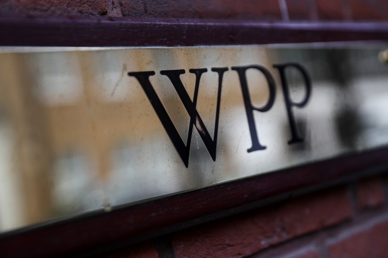 © Reuters. A logo hangs on the wall outside the WPP offices in London