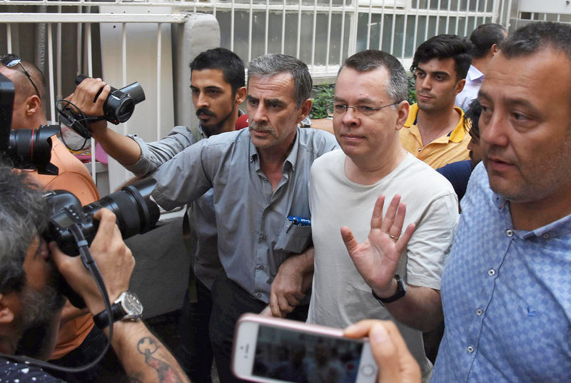 © Reuters. FILE PHOTO: U.S. pastor Andrew Brunson reacts as he arrives at his home after being released from the prison in Izmir