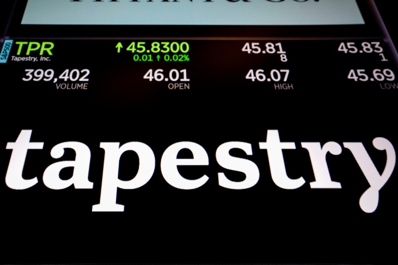 © Reuters. Tapestry Inc. logo and trading information are displayed on a screen on the floor of the NYSE in New York