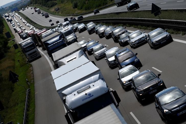 © Reuters. Cars and trucks drive along a motorway near Roth