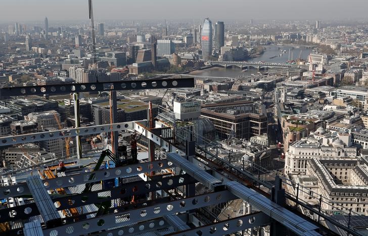 © Reuters. A steel is craned into position on the AXA IM - Real Assets Twentytwo building in London