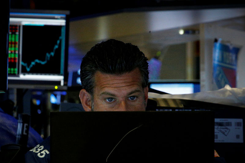 U.S. stocks drop on downbeat earnings, trade tensions