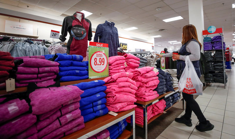 © Reuters. FILE PHOTO: A shopper checks on merchandise at the J.C. Penney department store in North Riverside