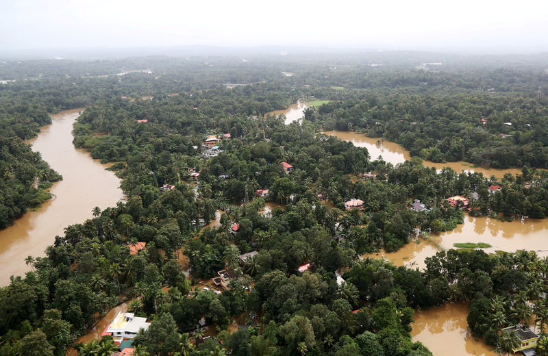 © Reuters. An aerial view shows partially submerged houses at a flooded area in the southern state of Kerala