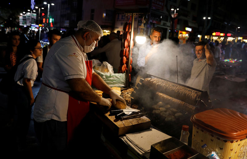 © Reuters. A street vendor sells food on a main street in central Ankara